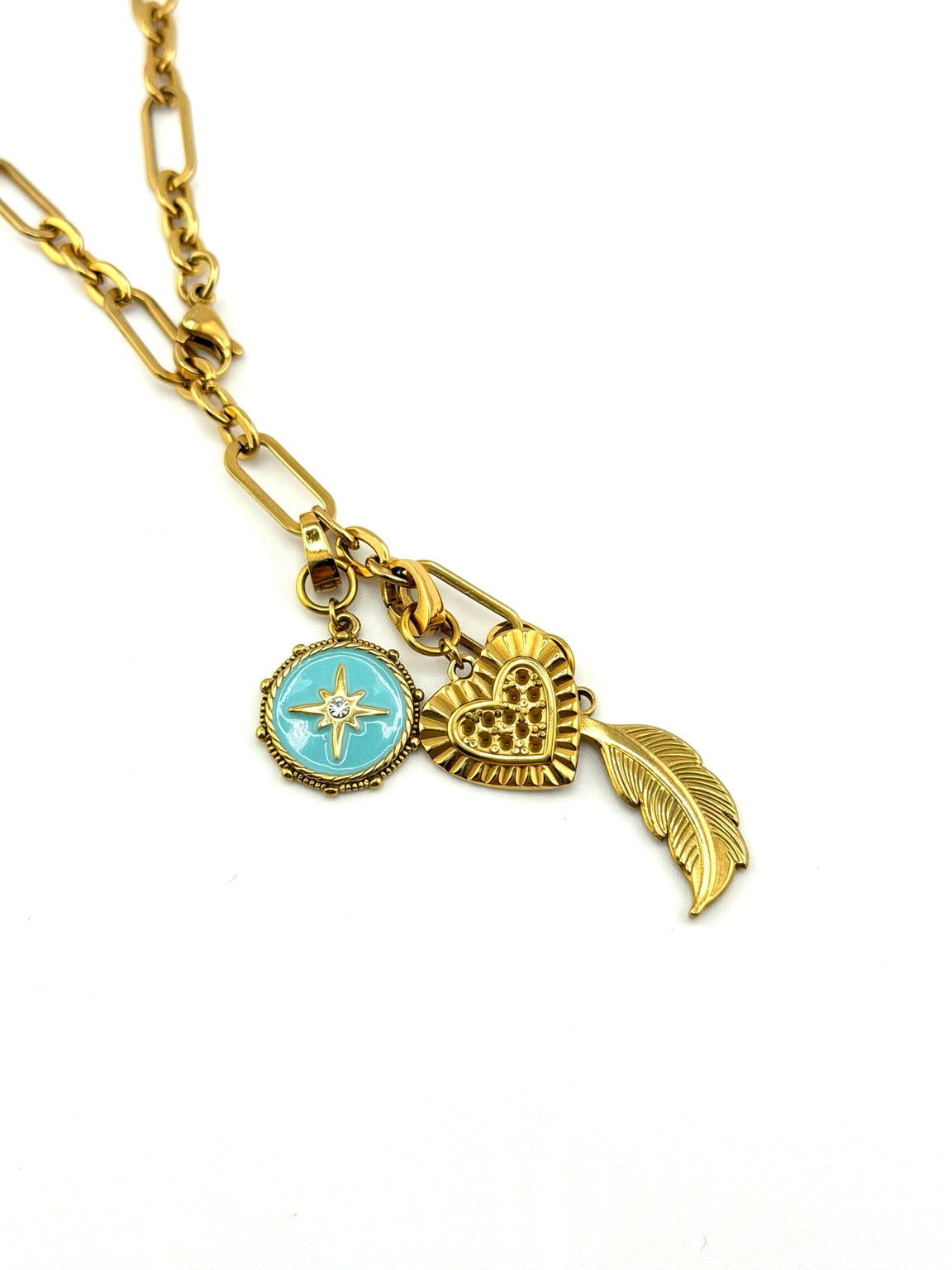 Free Spirit necklace turquoise star, golden heart and feather charms close-up