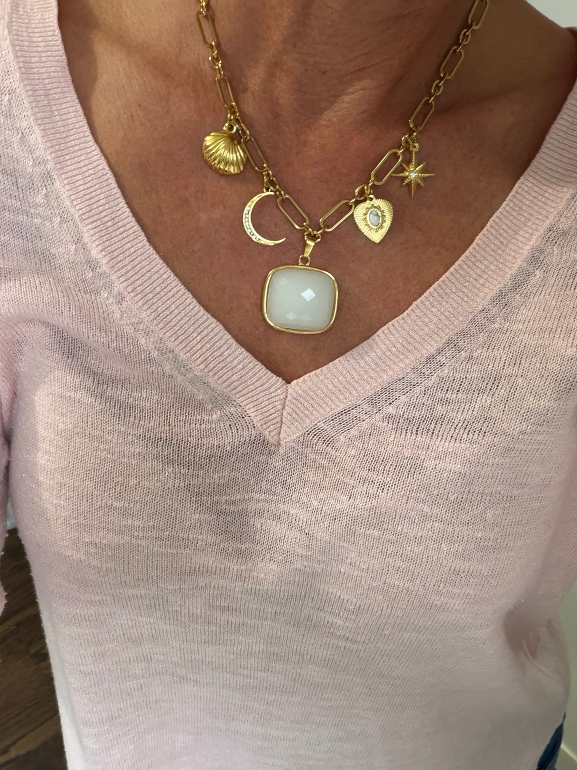 The Evelyn necklace worn with pale pink sweater